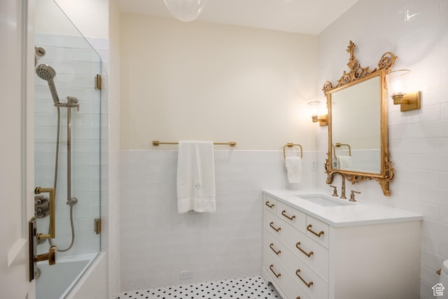 2590 E Olympus Dr, Holladay, UT 84124 - bathroom featuring vanity, shower / washtub combination, and tile walls
