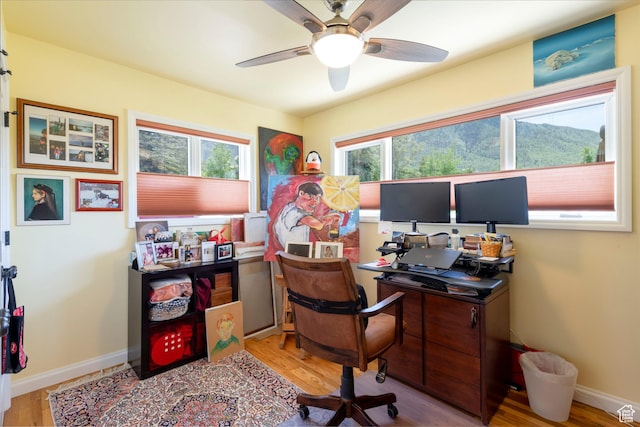 3555 E Hermes Dr S, Salt Lake City, UT 84124 - office area with wood finished floors, a ceiling fan, and baseboards