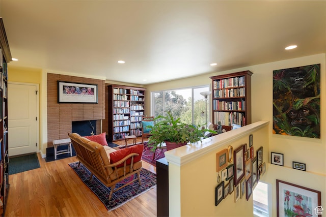 3555 E Hermes Dr S, Salt Lake City, UT 84124 - living area with wood finished floors, a fireplace, and recessed lighting