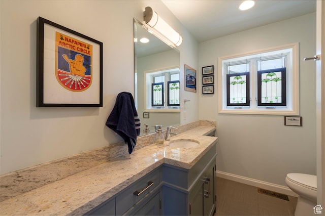 3555 E Hermes Dr S, Salt Lake City, UT 84124 - bathroom featuring vanity, toilet, and baseboards