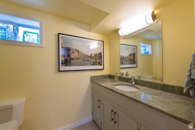 3555 E Hermes Dr S, Salt Lake City, UT 84124 - bathroom featuring toilet, plenty of natural light, vanity, and baseboards