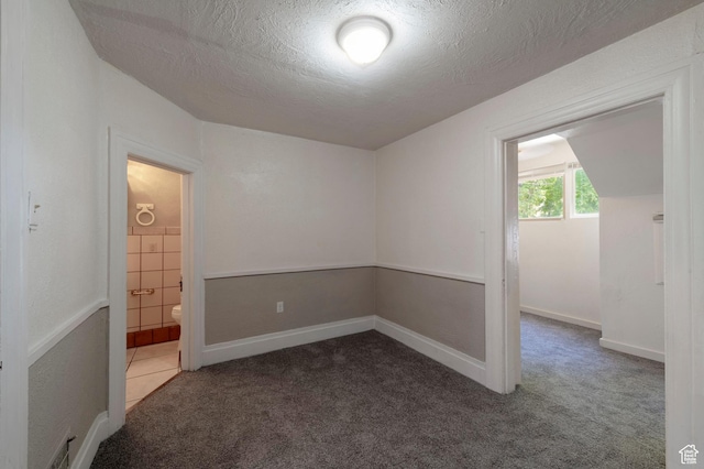233 S 1100 E, Salt Lake City, UT 84102 - unfurnished room featuring carpet floors and a textured ceiling