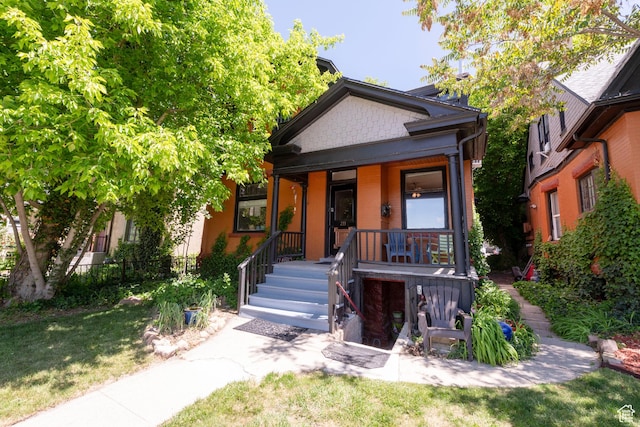 233 S 1100 E, Salt Lake City, UT 84102 - view of front of property with a porch and a front lawn