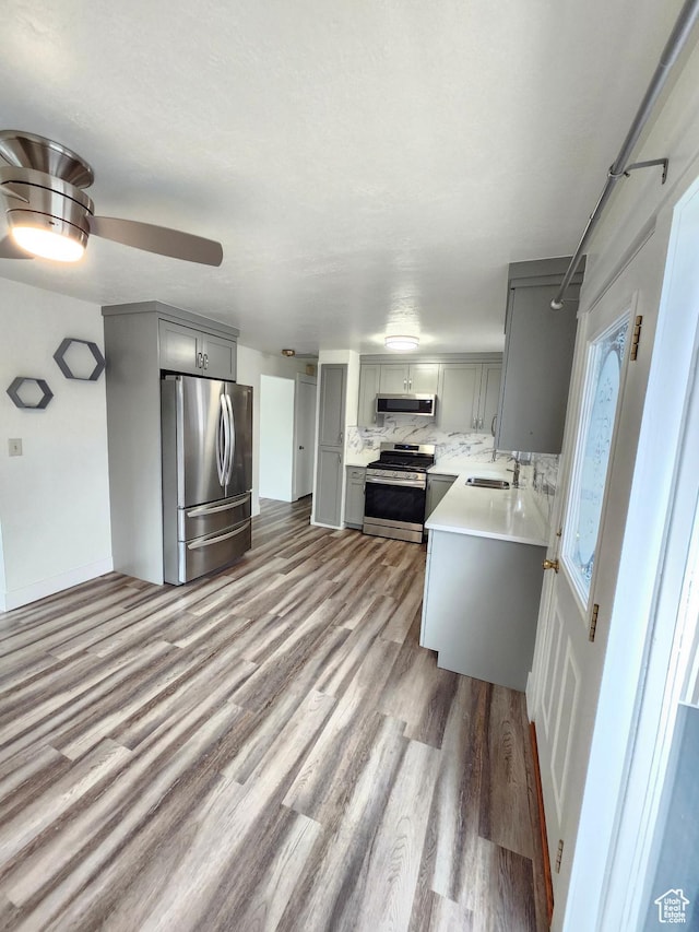317 S 200 W, Price, UT 84501 - kitchen featuring stainless steel appliances, gray cabinets, wood finished floors, and light countertops