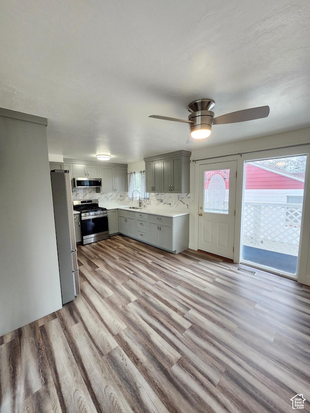 317 S 200 W, Price, UT 84501 - kitchen featuring stainless steel appliances, gray cabinetry, a sink, and plenty of natural light