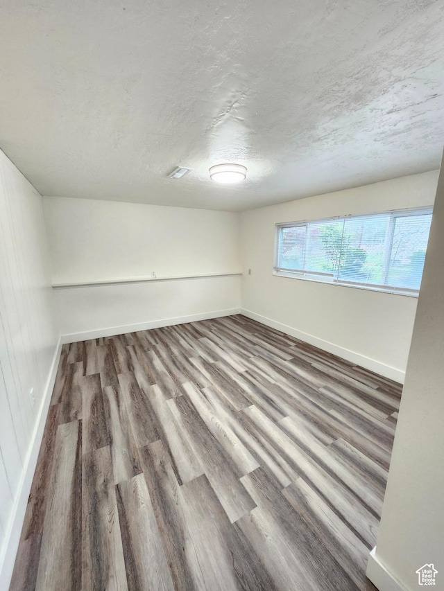 317 S 200 W, Price, UT 84501 - unfurnished room with baseboards, wood finished floors, and a textured ceiling