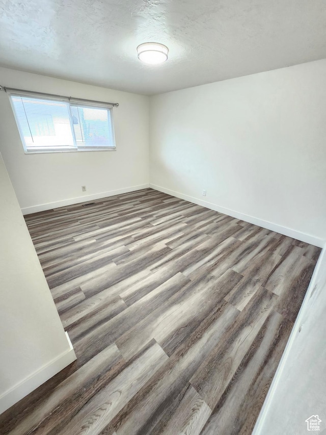317 S 200 W, Price, UT 84501 - spare room featuring baseboards and wood finished floors