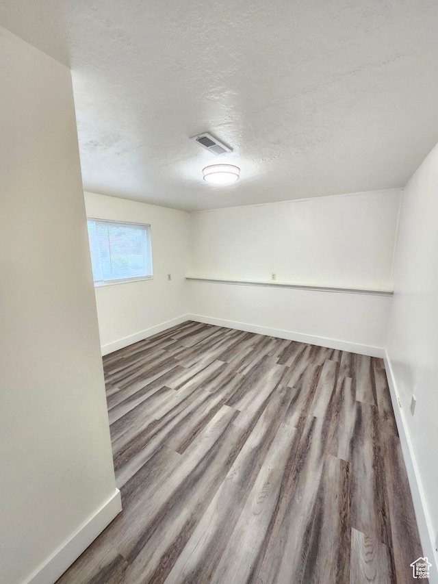 317 S 200 W, Price, UT 84501 - unfurnished room with baseboards, wood finished floors, and a textured ceiling