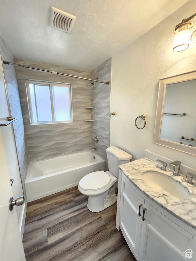 317 S 200 W, Price, UT 84501 - bathroom featuring vanity, washtub / shower combination, wood finished floors, and toilet