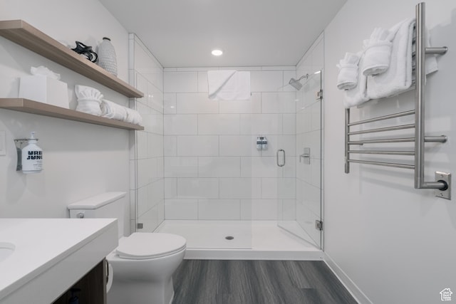 2670 Canyons Resort Dr Unit 113, Park City, UT 84098 - bathroom with radiator heating unit, toilet, a shower stall, wood finished floors, and vanity