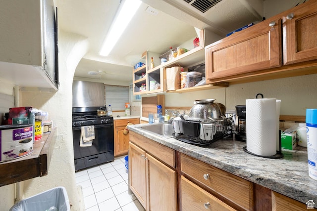 237 S 1100 E, Salt Lake City, UT 84102 - kitchen featuring black gas range oven, a sink, light tile patterned flooring, open shelves, and light countertops