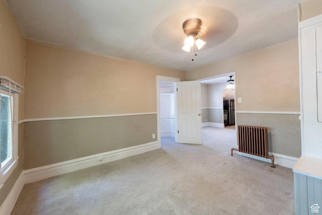 237 S 1100 E, Salt Lake City, UT 84102 - carpeted empty room with ceiling fan, radiator, and baseboards