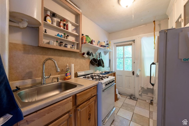 237 S 1100 E, Salt Lake City, UT 84102 - kitchen with white appliances, a sink, backsplash, brown cabinetry, and open shelves
