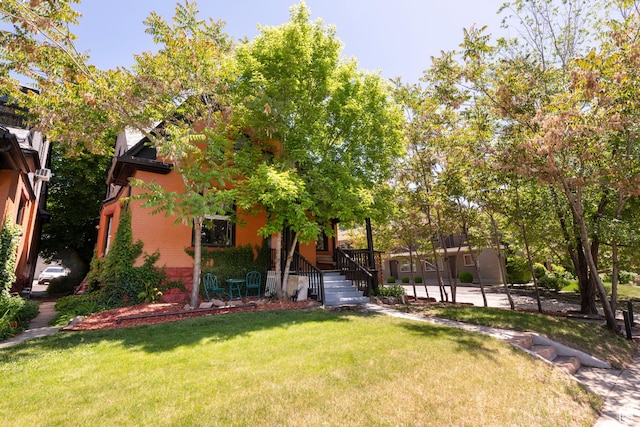 237 S 1100 E, Salt Lake City, UT 84102 - view of front of house with brick siding and a front lawn