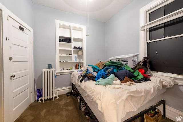 237 S 1100 E, Salt Lake City, UT 84102 - carpeted bedroom featuring radiator heating unit and baseboards