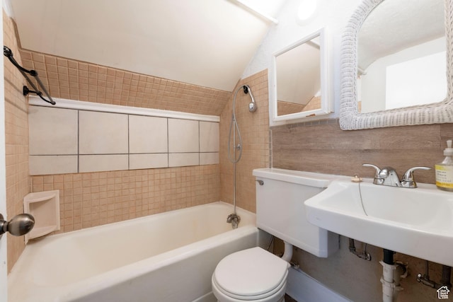 237 S 1100 E, Salt Lake City, UT 84102 - bathroom with vaulted ceiling, toilet, tub / shower combination, and tile walls