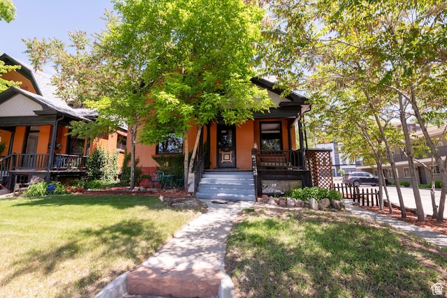 237 S 1100 E, Salt Lake City, UT 84102 - view of front of property featuring covered porch and a front lawn