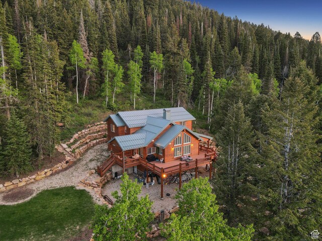 4708 Red Fir Way, Oakley, UT 84055 - rear view of property with a forest view, a wooden deck, and metal roof