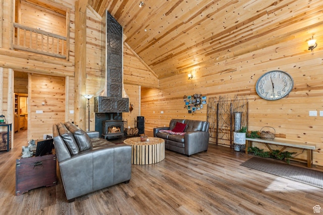 4708 Red Fir Way, Oakley, UT 84055 - living area featuring high vaulted ceiling, a wood stove, wood walls, wood ceiling, and wood finished floors