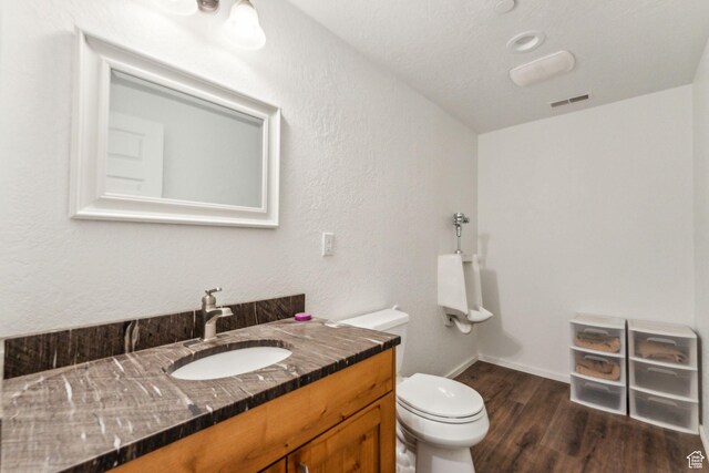 4708 Red Fir Way, Oakley, UT 84055 - bathroom featuring wood finished floors, toilet, vanity, and baseboards