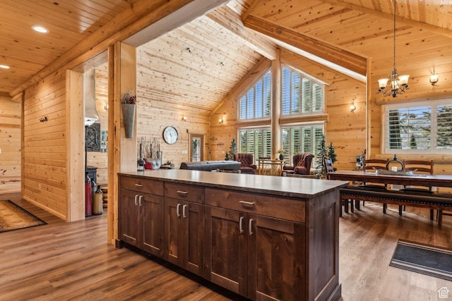 4708 Red Fir Way, Oakley, UT 84055 - kitchen with wooden ceiling with exposed beams, wood walls, dark wood finished floors, dark brown cabinetry, and a chandelier