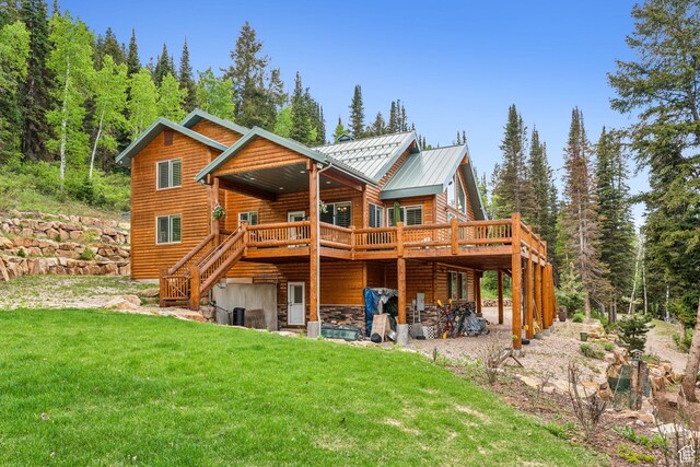 4708 Red Fir Way, Oakley, UT 84055 - back of property featuring a standing seam roof, a yard, a wooden deck, metal roof, and stairs