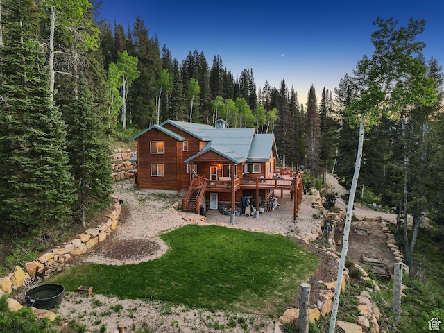 4708 Red Fir Way, Oakley, UT 84055 - back of property with a forest view, stairs, a deck, a lawn, and metal roof