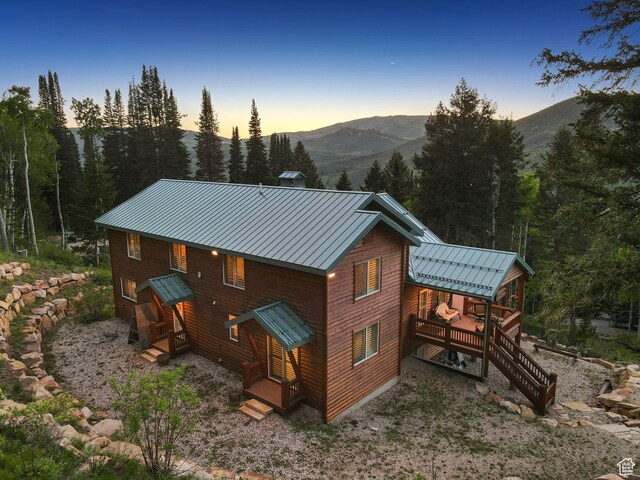 4708 Red Fir Way, Oakley, UT 84055 - back of property at dusk with a standing seam roof, metal roof, and a mountain view