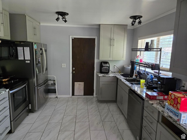 2610 W Bueno Vista Dr S, West Jordan, UT 84088 - kitchen with appliances with stainless steel finishes, crown molding, gray cabinetry, and light stone countertops