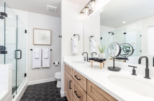 12852 N Belaview Way, Hideout, UT 84036 - full bathroom featuring a shower stall, double vanity, toilet, tile patterned floors, and baseboards