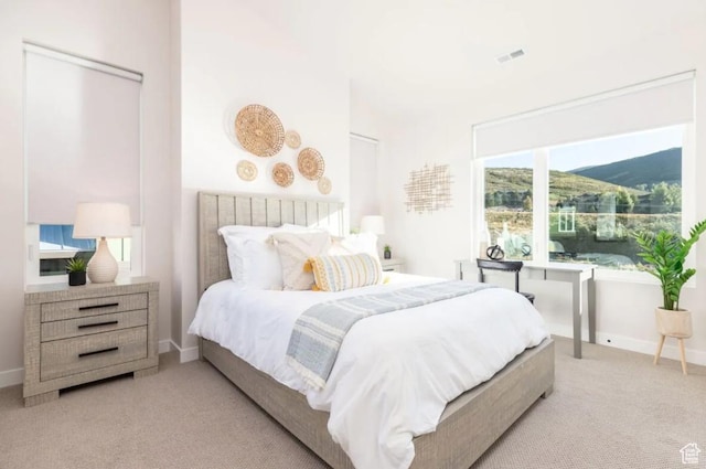 12852 N Belaview Way, Hideout, UT 84036 - bedroom with light colored carpet, multiple windows, and baseboards