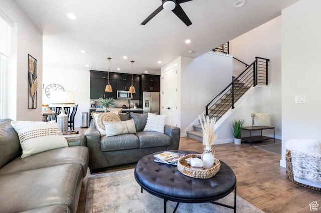 12852 N Belaview Way, Hideout, UT 84036 - living room with light wood-type flooring, stairs, a ceiling fan, recessed lighting, and baseboards