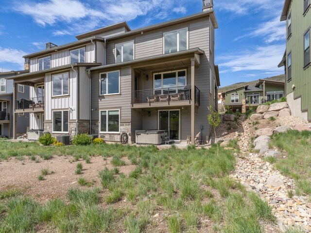 12852 N Belaview Way, Hideout, UT 84036 - rear view of property with a chimney, a balcony, and cooling unit