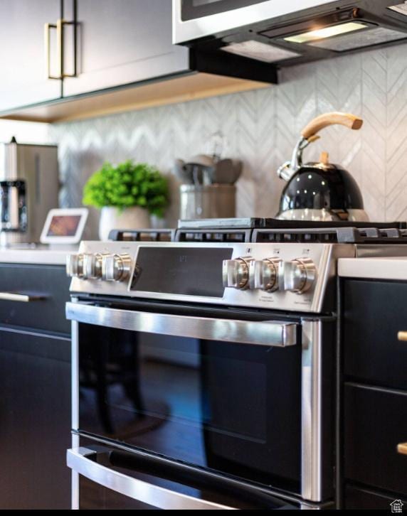 12852 N Belaview Way, Hideout, UT 84036 - kitchen with stainless steel gas range oven and backsplash