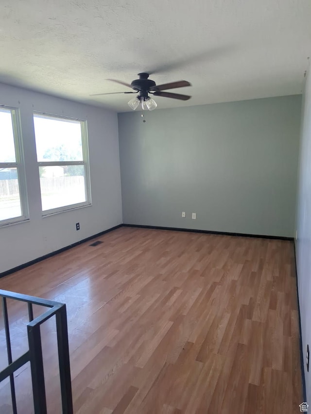 1162 N Liberty Ave, North Ogden, UT 84404 - empty room with a ceiling fan and light wood-style flooring