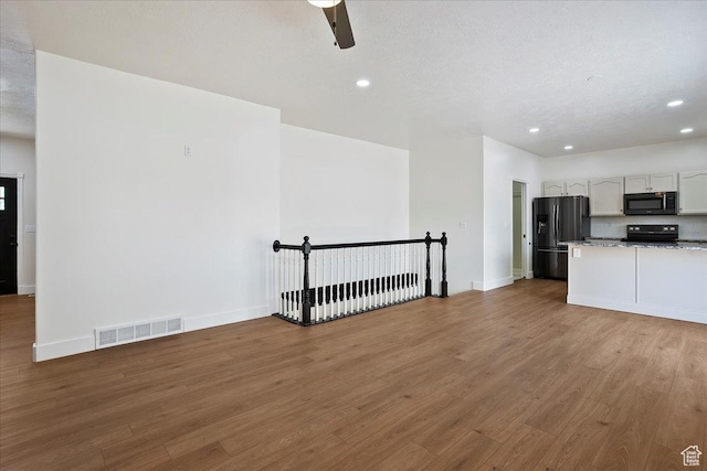 494 E 3525 N, North Ogden, UT 84414 - kitchen with black appliances, recessed lighting, wood finished floors, baseboards, and ceiling fan
