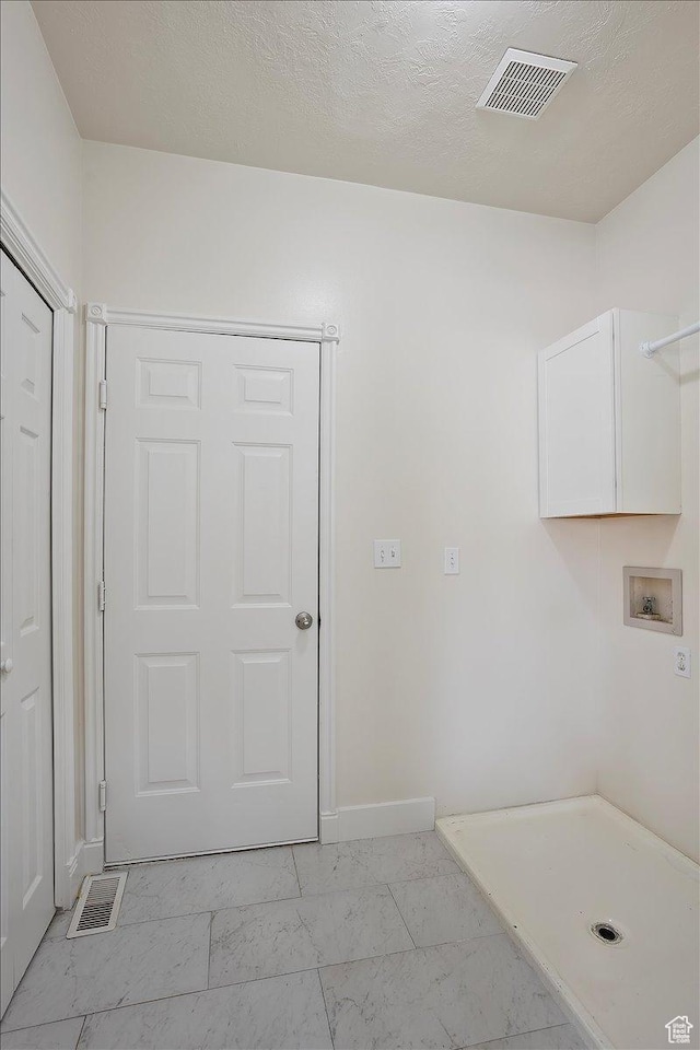 494 E 3525 N, North Ogden, UT 84414 - laundry room with hookup for a washing machine, light marble finish floors, cabinet space, and baseboards