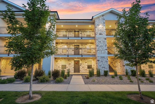 67 W 600 S Unit B204, Springville, UT 84663 - view of front of home featuring stone siding, a balcony, and stucco siding