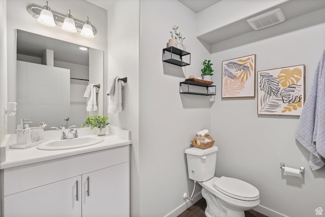 67 W 600 S Unit B204, Springville, UT 84663 - bathroom featuring toilet, vanity, baseboards, and wood finished floors