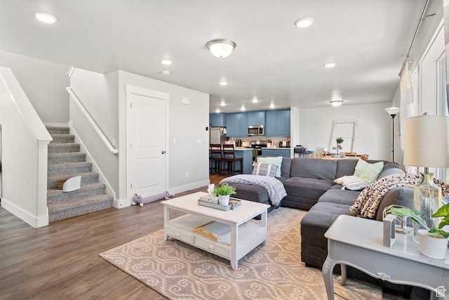 432 W 1470 N, Tooele, UT 84074 - living room featuring wood finished floors, recessed lighting, and stairway