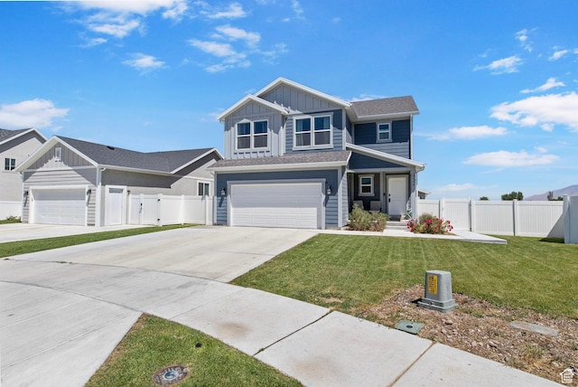 432 W 1470 N, Tooele, UT 84074 - view of front of home with board and batten siding, concrete driveway, an attached garage, and a gate