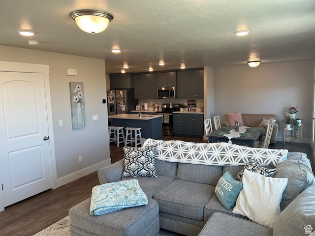 432 W 1470 N, Tooele, UT 84074 - living room with baseboards, dark wood-style floors, and a textured ceiling