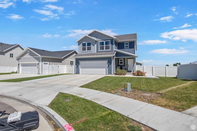 432 W 1470 N, Tooele, UT 84074 - view of front of house with board and batten siding, concrete driveway, and a garage