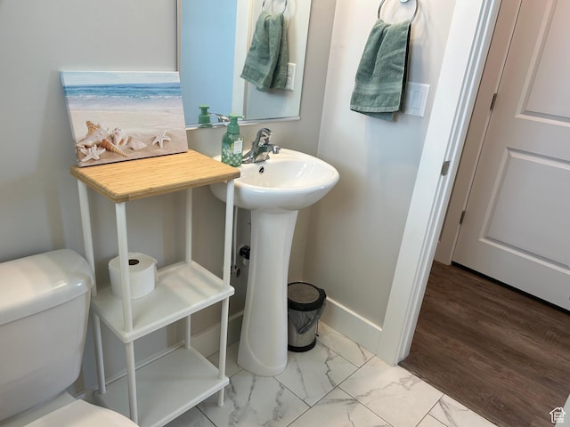 432 W 1470 N, Tooele, UT 84074 - bathroom featuring marble look tiles and toilet