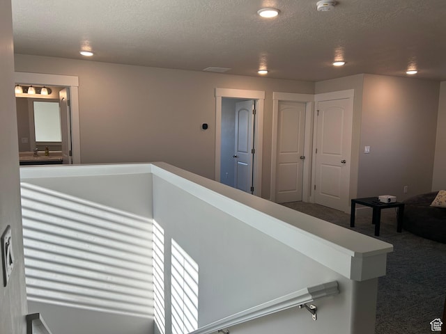 432 W 1470 N, Tooele, UT 84074 - corridor featuring carpet, a textured ceiling, recessed lighting, and an upstairs landing