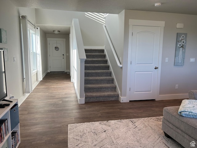 432 W 1470 N, Tooele, UT 84074 - foyer with stairs, dark wood-style floors, and baseboards