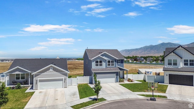 432 W 1470 N, Tooele, UT 84074 - traditional home featuring concrete driveway, a mountain view, board and batten siding, and a gate