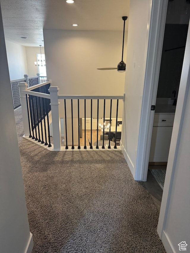 4569 W Ruple Ridge Ln S, Herriman, UT 84096 - corridor featuring carpet flooring, an upstairs landing, recessed lighting, and a chandelier