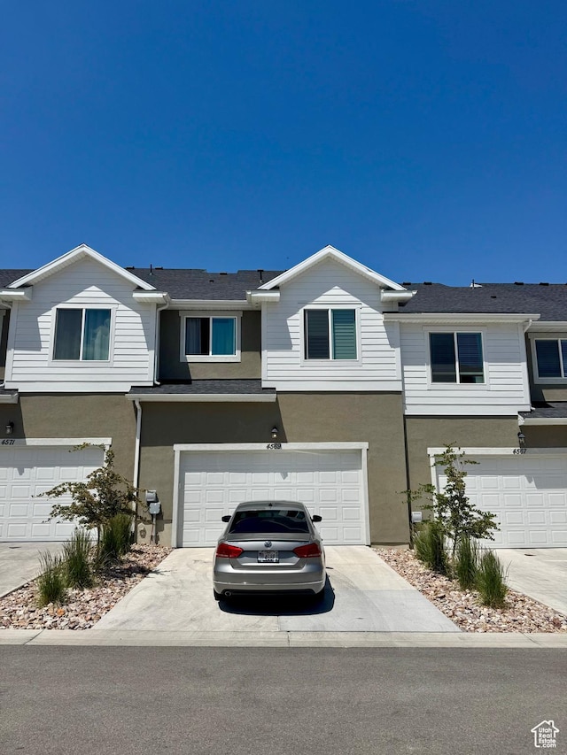 4569 W Ruple Ridge Ln S, Herriman, UT 84096 - multi unit property featuring stucco siding, a garage, and driveway