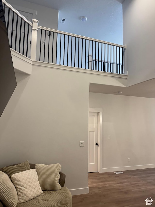 4569 W Ruple Ridge Ln S, Herriman, UT 84096 - living room with wood finished floors, baseboards, and a towering ceiling
